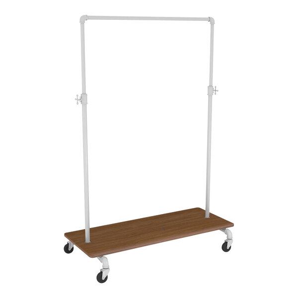 A wooden garment rack with a metal bar on wheels and a brown shelf.