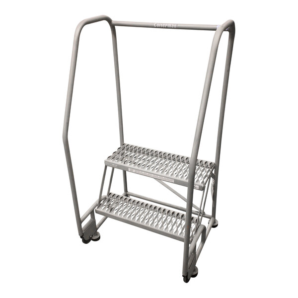 A gray metal Cotterman rolling ladder with wheels.