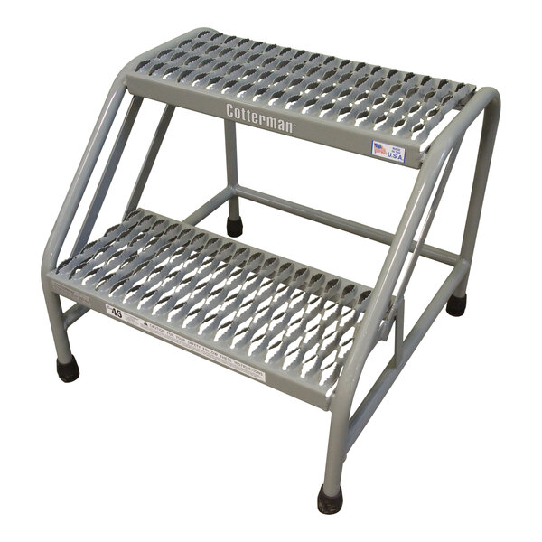 A grey powder-coated steel step stand with metal steps.