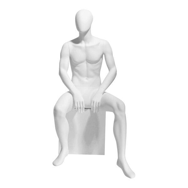 A white Econoco male oval head mannequin seated with legs crossed.