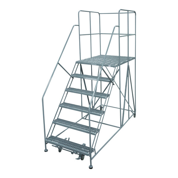 A grey metal Cotterman rolling work platform with metal stairs and wheels.