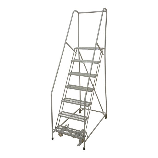 A gray powder-coated steel Cotterman rolling ladder with a handrail and wheels.