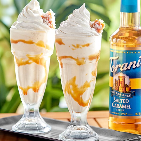 Two glasses of ice cream with Torani sugar-free salted caramel syrup.