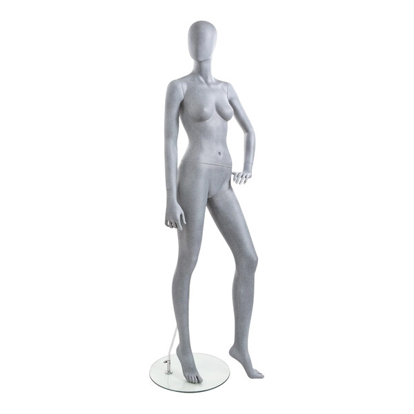 An Econoco female mannequin with left hand on hip and left leg forward.