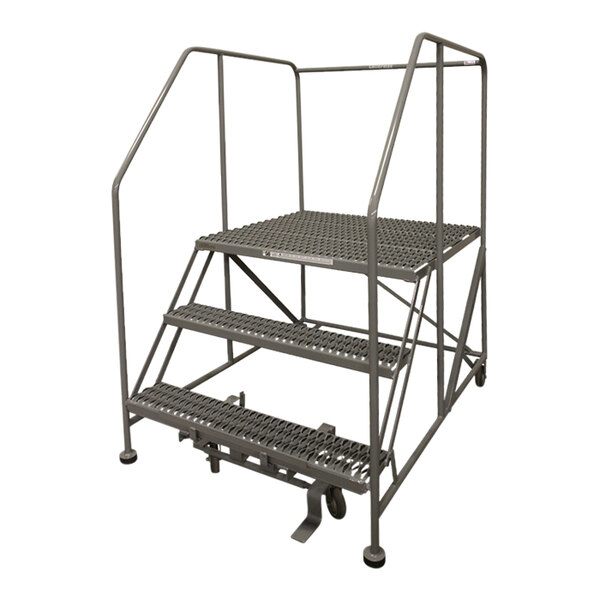A gray powder-coated steel Cotterman rolling work platform with metal steps and metal bars.
