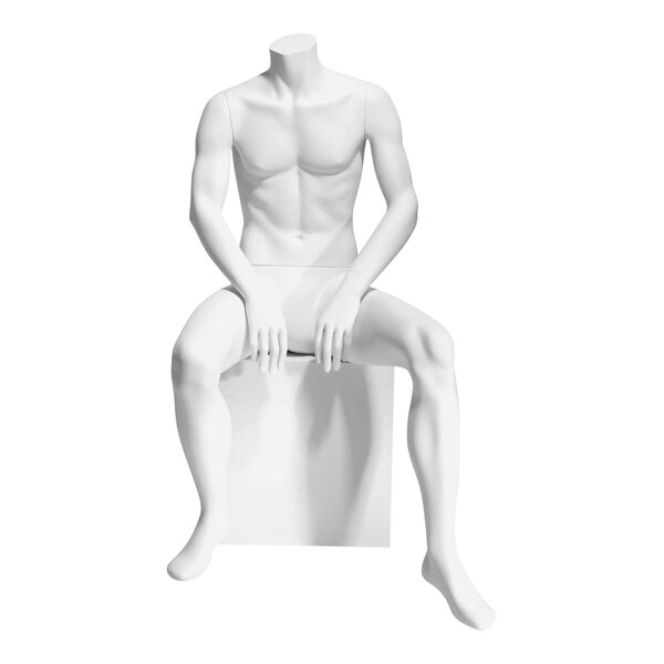 A headless white male mannequin seated on a white surface.