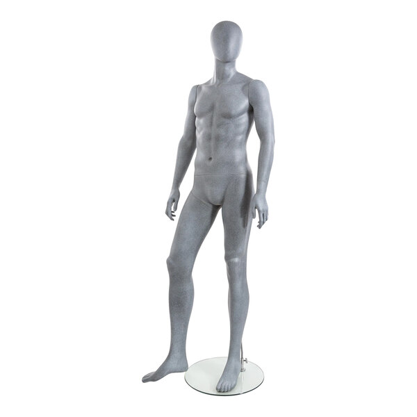 A slate male mannequin with arms at sides and right leg bent standing on a white base.