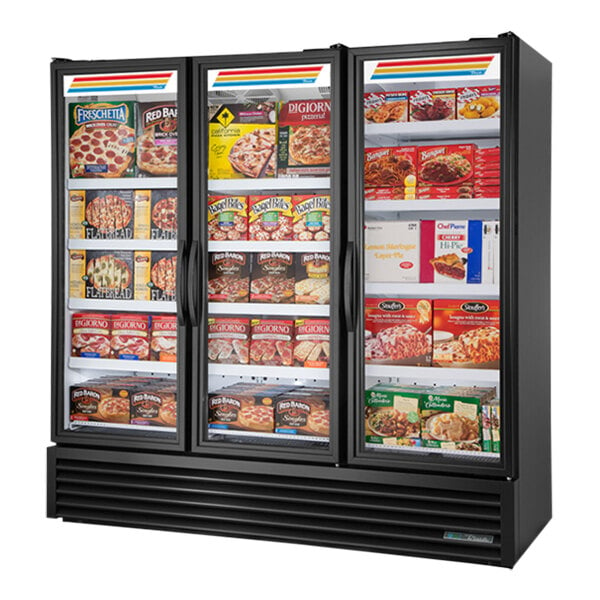 A True black glass door merchandiser freezer with food on the shelves.