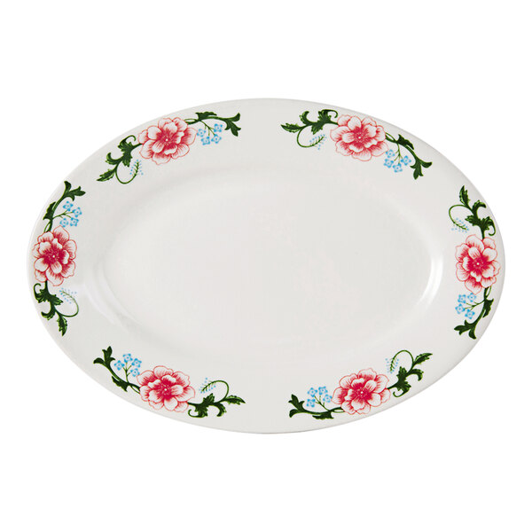An eggshell white Tuxton China oval platter with pink flowers on it.