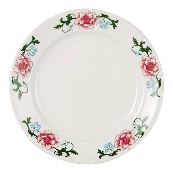 A white Tuxton china plate with red flowers and green leaves.