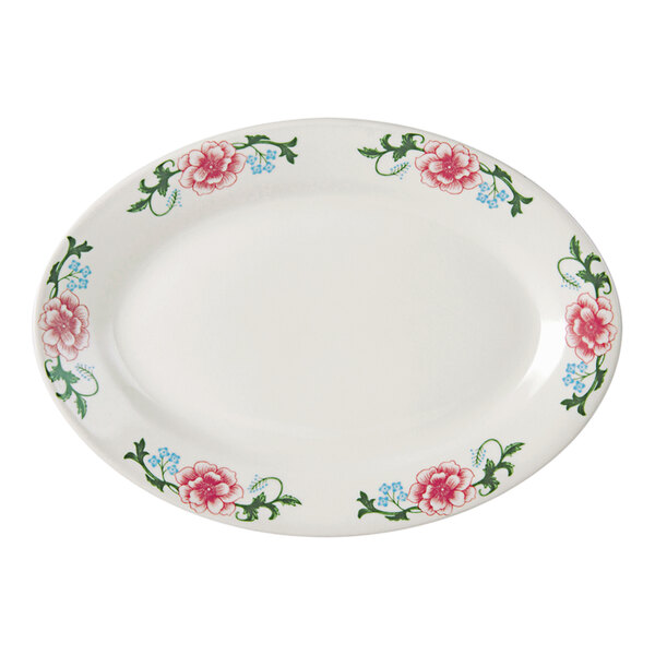 A white Tuxton china oval platter with pink flowers on it.