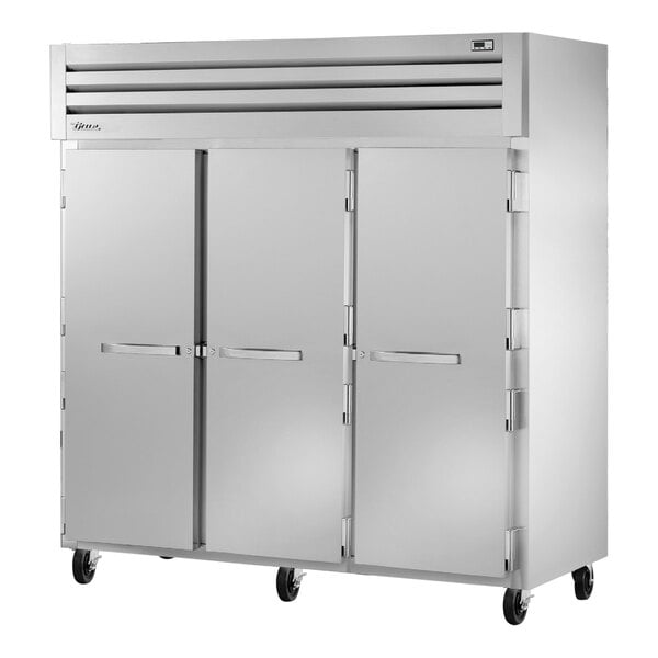 A True STA3F-3S reach-in freezer with three solid doors.