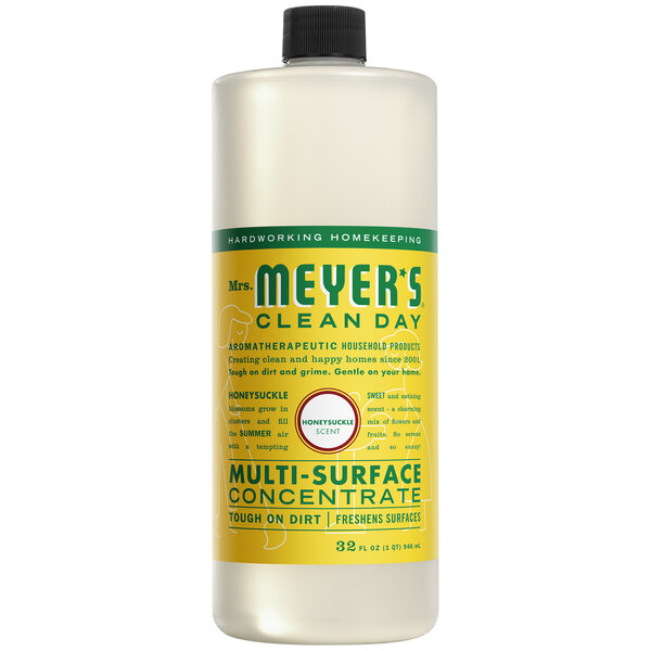 A white bottle of Mrs. Meyer's Honeysuckle All Purpose Multi-Surface Cleaner concentrate with a yellow label.