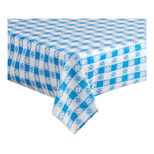 A close-up of a blue and white checkered Table Mate plastic table cover on a table.
