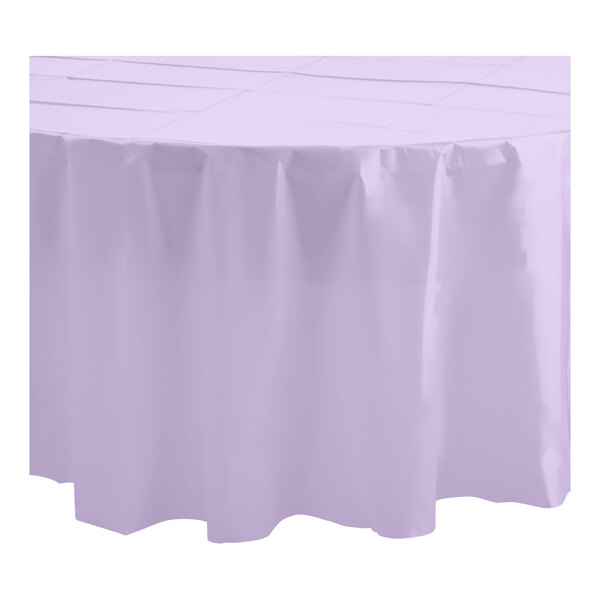 A lavender plastic table cover with a white surface and a round table.