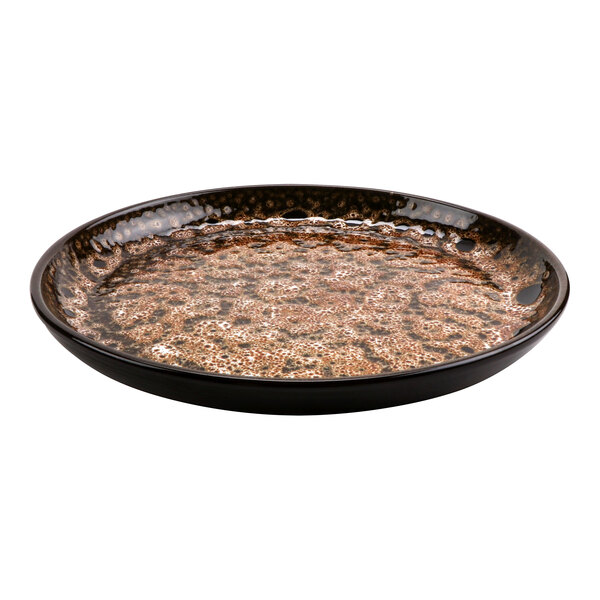 A brown and black cheforward by GET Graupera terracotta deep plate with a patterned surface.
