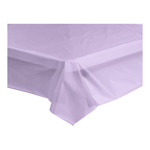 A lavender plastic table cover on a white table.
