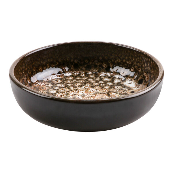 A brown terracotta bowl with a speckled design.