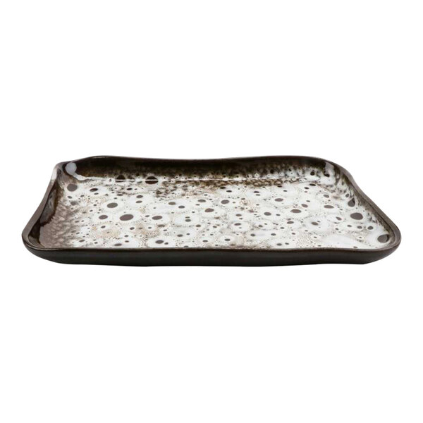 A rectangular cheforward terracotta tray with a speckled design.
