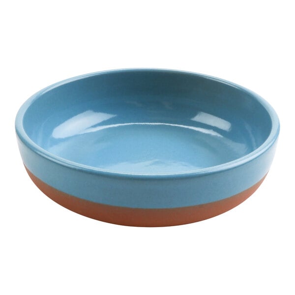 A blue terracotta bowl with a brown rim.