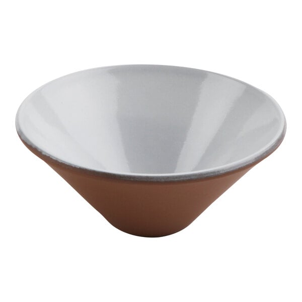 A white terracotta bowl with a white rim and brown accents.