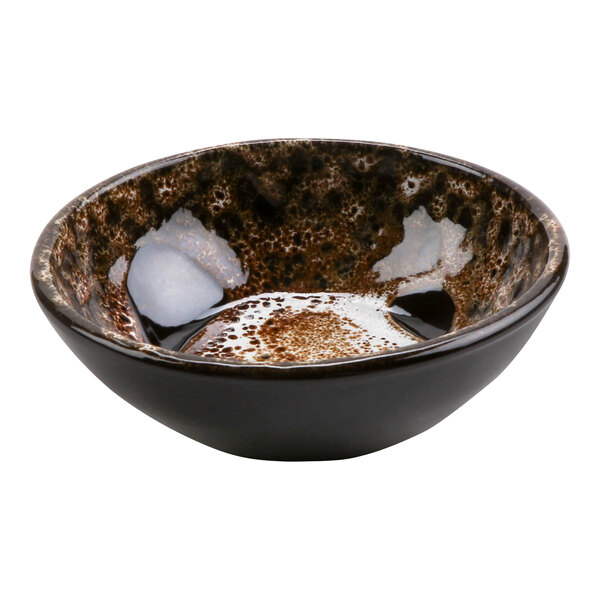 A brown terracotta bowl with white speckles.