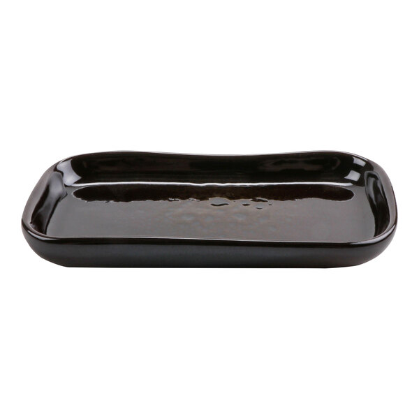 A black rectangular terracotta tray with a curved edge and a small handle.