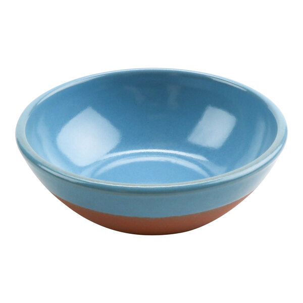 A close-up of a blue and brown cheforward by GET Graupera Stone Heart terracotta bowl.