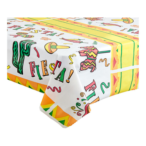 A Table Mate Fiesta Time plastic table cover roll with a colorful pattern on a table.