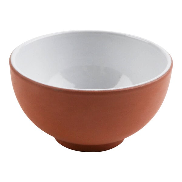 A white terracotta bowl with a brown base and white border.