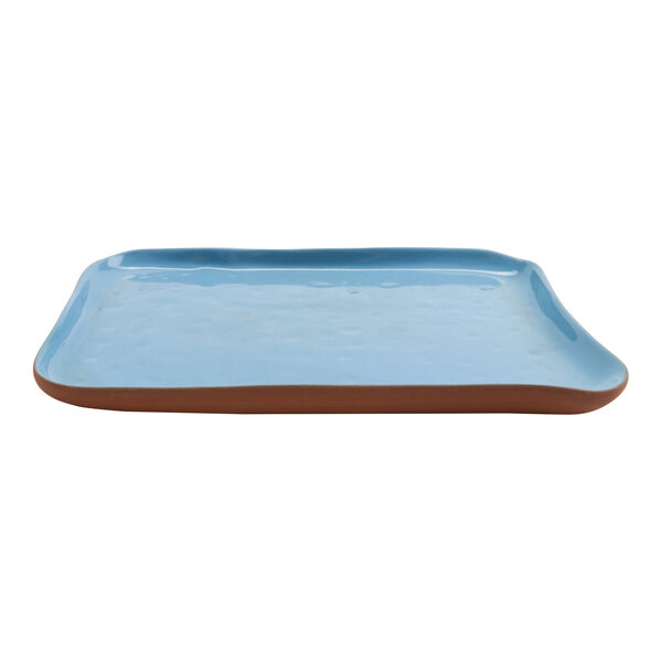A blue rectangular terracotta tray with brown handles.