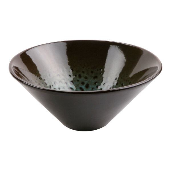 A terracotta bowl with a black surface and white speckles.