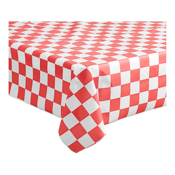 A red and white checkered Table Mate plastic tablecloth on a table.