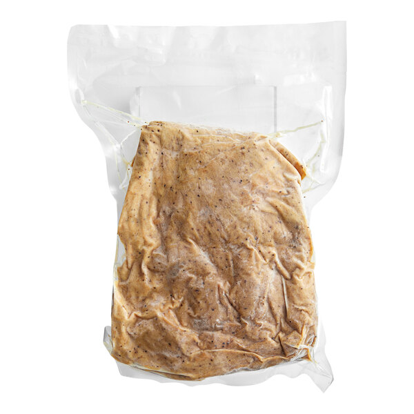 A plastic bag of The BE Hive Plant-Based Vegan Trky Slices on a white background.