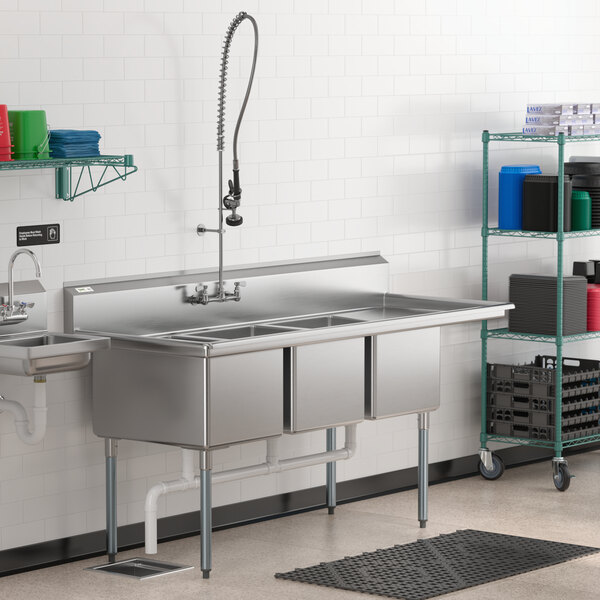 A Regency stainless steel three compartment sink with a right drainboard.