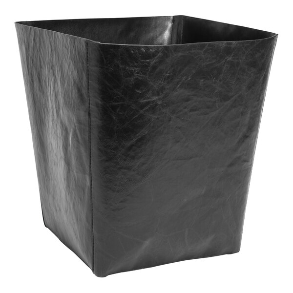A Room360 black faux leather wastebasket.