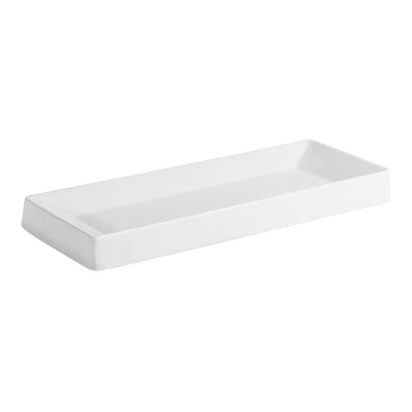 A white rectangular Room360 porcelain amenity tray with a handle.