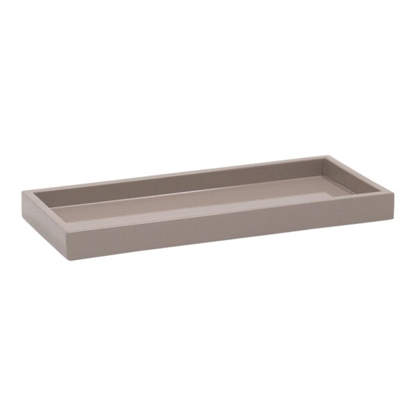 A Room360 New York beige stone resin rectangular amenity tray with a handle.