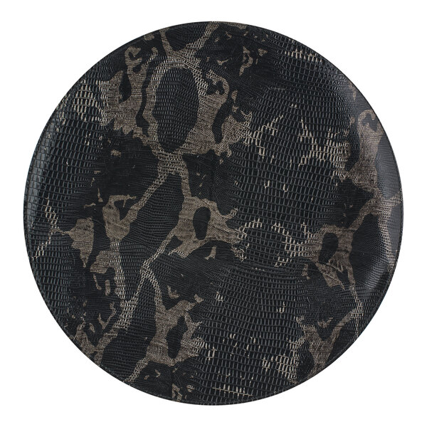 A Room360 Sumatra henna mat with black and brown snake skin pattern on a table.