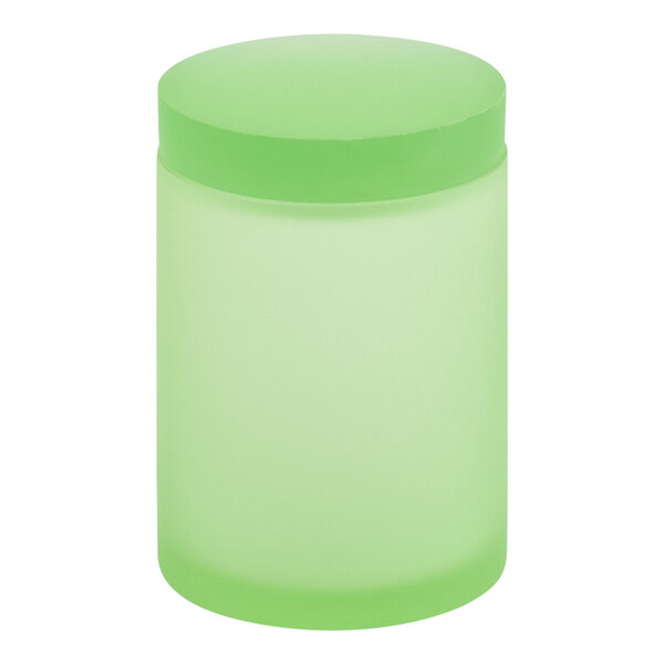 A green cylindrical Room360 Nassau storage jar with a green lid.