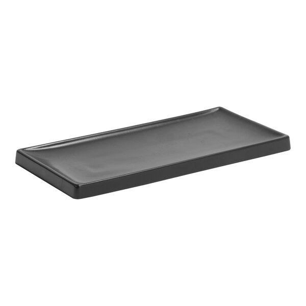 A black rectangular Room360 amenity tray.