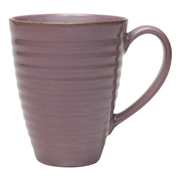 A mauve terracotta mug with a handle.