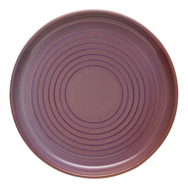 A purple Libbey terracotta plate with a spiral pattern.