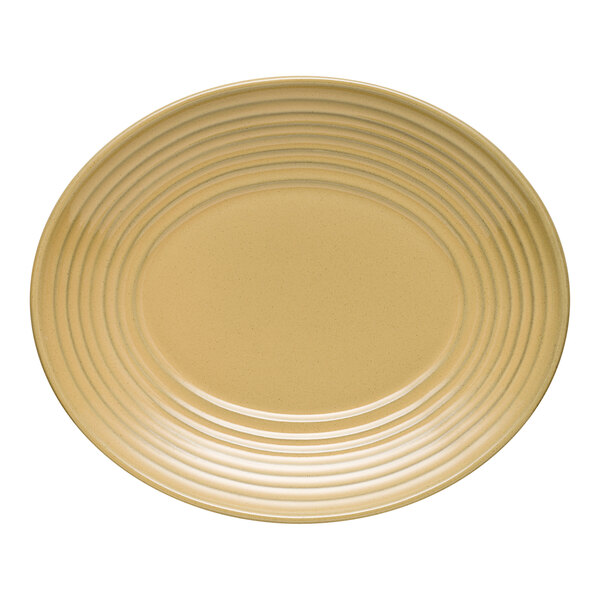 A close-up of a tan oval Libbey Terracotta platter with a stripe design.