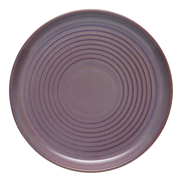 A Libbey mauve terracotta stoneware plate with spiral lines.