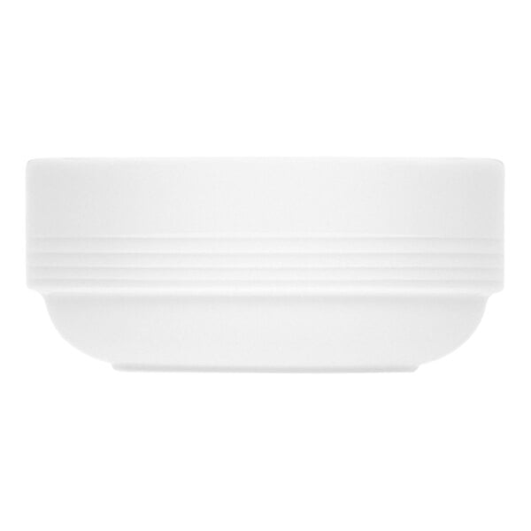 A bright white Bauscher by BauscherHepp Dialog porcelain soup bowl with lines on it.