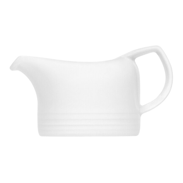 A Bauscher white porcelain sauce boat with a handle.