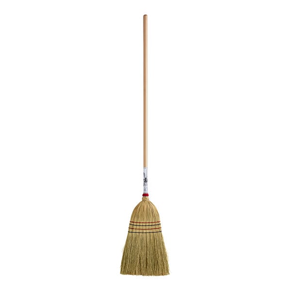 A Light-Duty Authentic Amish-Made Corn Broom with a long wooden handle.