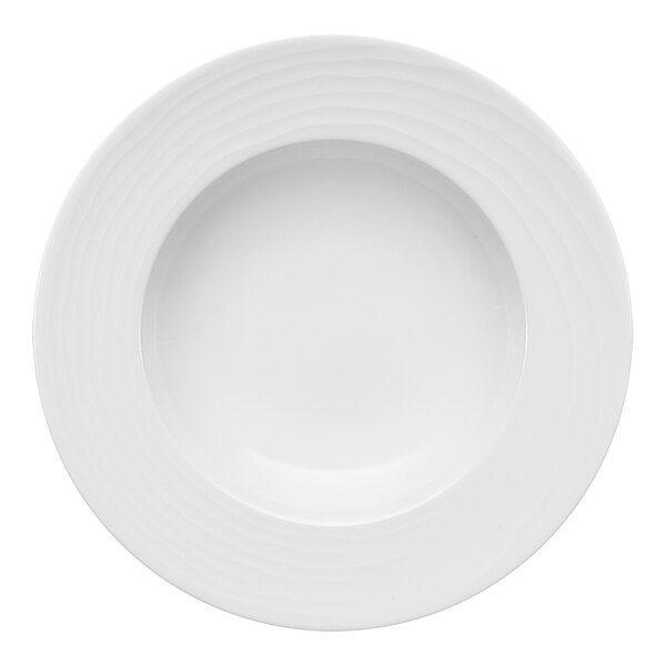 A Bauscher bright white porcelain plate with a circular pattern on the rim.