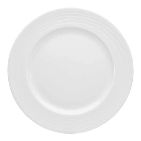 A Bauscher bright white porcelain plate with a wide, circular rim decorated with wavy lines.